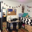 Ashley Gistinger has three strands of photos hanging from twine and clothespins in her dorm room.