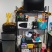 The photo shows the organization unit used to store a tv on top, a microwave and a coffee pot on the second shelf.